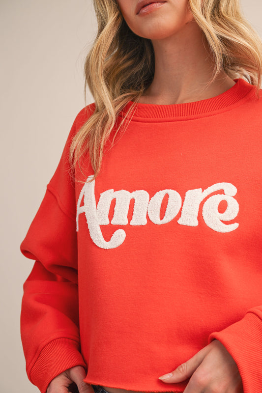 AMORE LONG SLEEVE FLEECE SWEATSHIRT WITH GRAPHIC FLOCKING